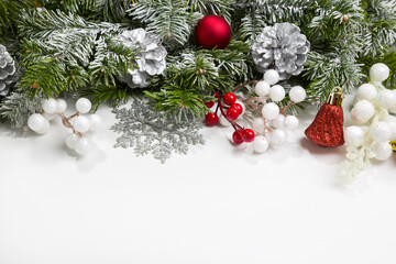 Christmas card with fir branches and Christmas decorations