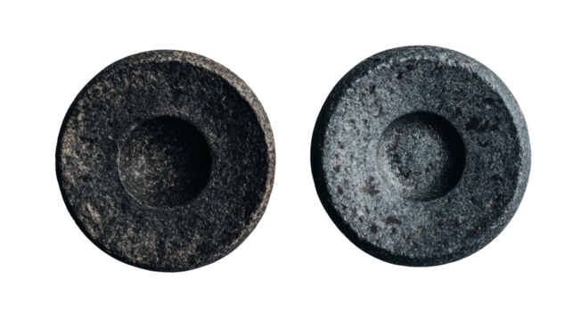 Two stone/concrete discs with central indentations
