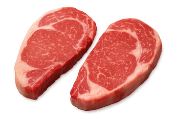 Raw beef ribeye steaks showing rich red meat and marbling, preparing for grilling or cooking, transparent background