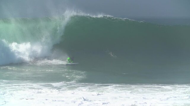 Surfer getting a perfect  barrel