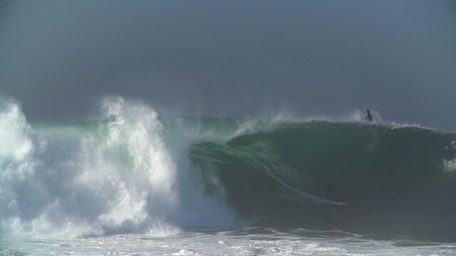 Surfer getting a full barrel wave at the wedge