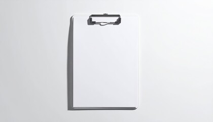 Blank white clipboard lies flat in bright, clean studio