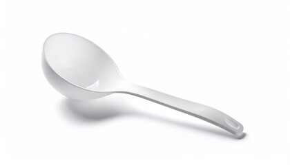 White plastic serving spoon, angled on a white surface