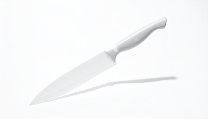White chef's knife casting shadow on white background