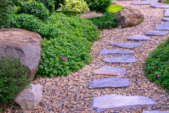 Stone stepping Walkway among lawn in a Japanese style garden.