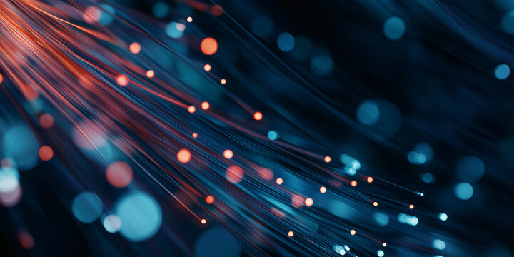 Closeup of glowing fiber optic cables with blue and red lights
