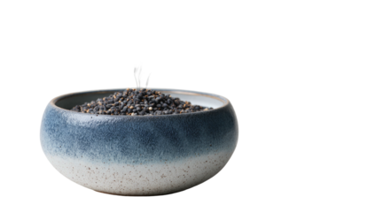 Small, gray bowl filled with dark grains on a dark background