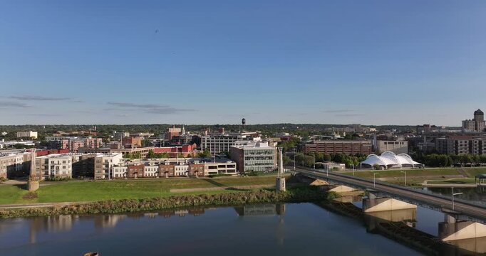 Aerial view of the cityscape with buildings, a bridge over the river, and the distinctive skyline of Dayton, Ohio, United States.