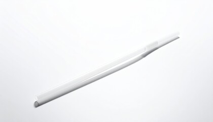Angled, white plastic straw with pointy end on white background