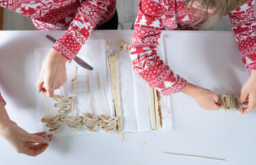 Family hands preparing christmas pastries for holiday baking