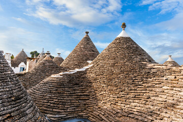 beatiful roofs in old vintage style with picturesque cloudy sly on background. Antique architecture...
