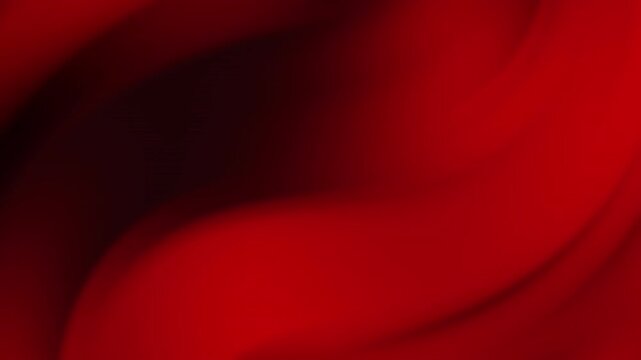 A beautiful and elegant abstract background featuring flowing waves of rich red fabric, creating a sense of smooth, dynamic motion and luxurious texture