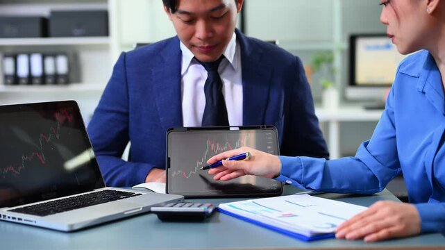 Two stock traiders making analysis of digital market and investment in block chain crypto currency. Stock trade concept