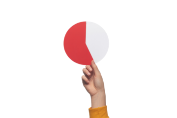 hand holding red and white pie chart on white background.