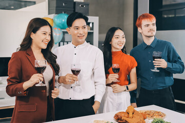 Diversity, dinner and group of people toast celebration together at party. Friends, happy and celebrate with food, wine and friendship for love, support and cheers champagne at business function