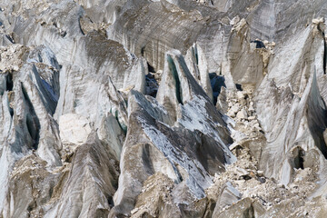 Jagged ice formations and rocks on a glacier