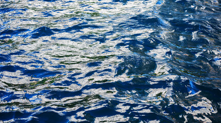 Glittering sea surface under bright sunlight.