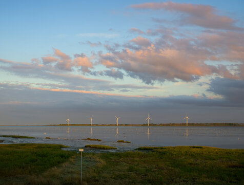 Windfarm at Oosterschelde estuary in the Netherlands during evening