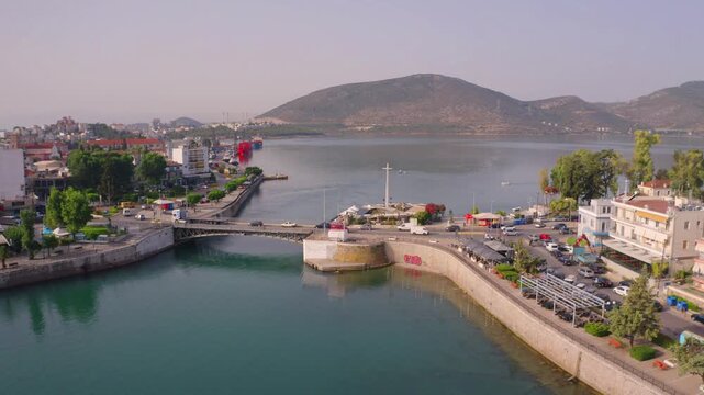 Splendid summer view from flying drone of Chalcis town with Chalkida's Old Bridge, Greece, Europe. Spectacular morning scene of Euboea island, Greece, Europe. 4K video (Ultra High Definition).