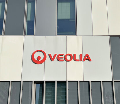 Veolia company logo on modern building facade. Represents environmental solutions, water management, waste management, and energy services. NANTES, France - January 10, 2025.