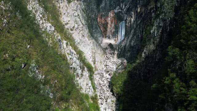 Gorgeous Boka waterfall on the side of a massive mountain, Slovenia, 4k