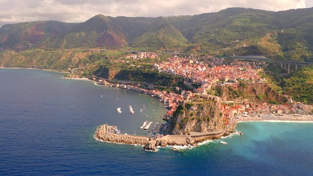 4k drone flight moving to the side footage (Ultra High Definition) of Reggio Calabria, Italy, Europe. Spectacular morning cityscape of Scilla port. Marvelous seascape of Mediterranean sea.