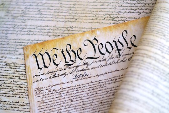 A parchment of the first Constitution of the United States close up - Powered by Adobe