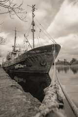 sunken and broken ships in a destroyed port in Ukraine during the war
