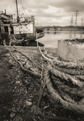 sunken and broken ships in a destroyed port in Ukraine during the war