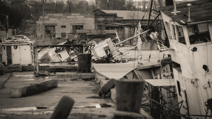 sunken and broken ships in a destroyed port in Ukraine during the war