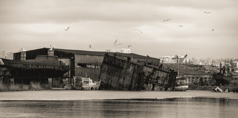 sunken and broken ships in a destroyed port in Ukraine during the war