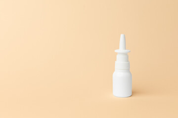 Nasal spray bottle on a soft pastel background, showcasing a minimalist design with ample copy space for branding and product information. copy space