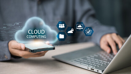 Cloud computing on smartphone beside laptop with hologram icons, data security concept