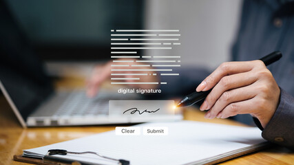 Digital signature on tablet with stylus beside laptop, e-sign document and approval