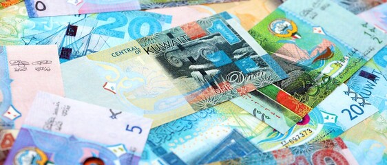 Kuwaiti dinar currency money bills. The current banknotes lies on table in big amount close up