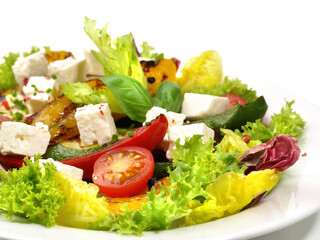 Fresh Mixed Salad with grilled Vegtables and Feta Cheese isolated on white Background