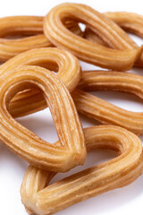 Traditional Spanish churros isolated on white background