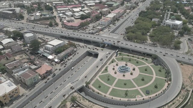 Aerial view of the RMK Bridge showing a bustling city with a mix of modern architecture, roads, and green spaces, Kano, Kano, Nigeria.
