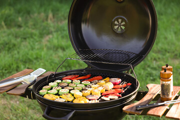 Vegetarian barbeque. Grill with different cooked vegetables outdoors