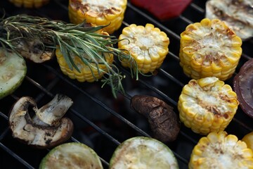 Vegetarian barbeque. Many different cooked vegetables on grill, closeup