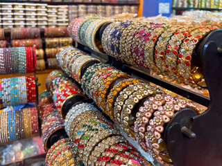 collection of traditional Indian bangles, bangles of colorful and different materials on sale store 