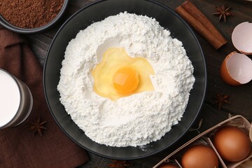 Ingredients for dough on wooden table, flat lay