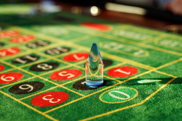 Roulette table closeup with marker on felt