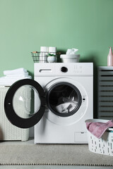 Laundry room with modern washing machine. Interior design