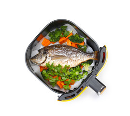 Grilled fish and vegetables in air fryer basket isolated on white, top view