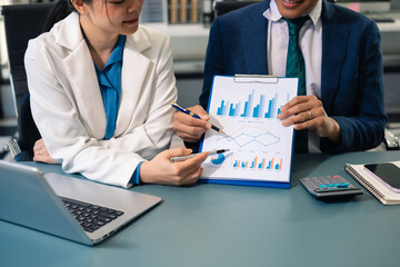 Business people discussing on performance revenue in meeting. financial adviser analyzing data with investor at office.