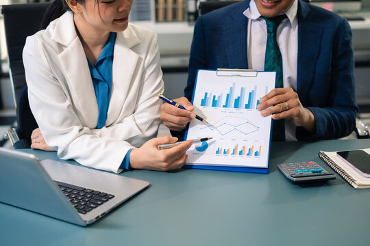 Business people discussing on performance revenue in meeting. financial adviser analyzing data with investor at office.