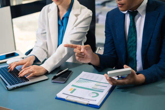 Business people discussing on performance revenue in meeting. financial adviser analyzing data with investor at office.