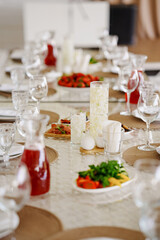 Celebration table set with food and drinks for guests