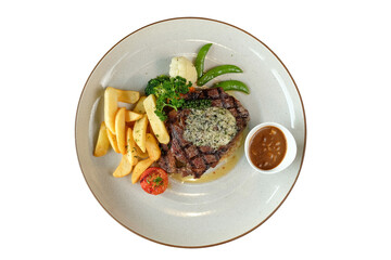 Delicious steak with various side dishes arranged on a plate
